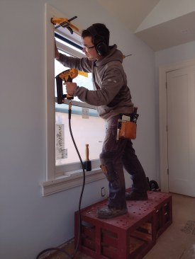 The author says that he often stands on the boxes while working.