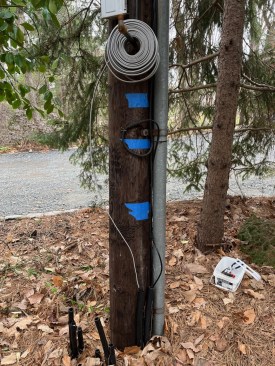 To power the new light, the author pulled new 12-gauge UF-B wire through the existing black poly conduit.