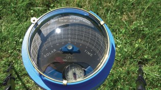 The Solar Pathfinder houses a sun-path diagram within a plastic dome. For a detailed description of its use, go to @EnergyUME on YouTube.